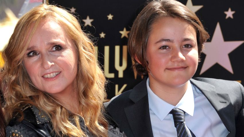 This photo, taken on September 27, 2011, shows singer Melissa Etheridge posing with her son Beckett during her Walk of Fame ceremony held at the Hard Rock cafe in Hollywood. Beckett Cypher, the singer's son with former partner Julie Cypher, died at age 21. (Photo by CHRIS DELMAS/AFP via Getty Images)