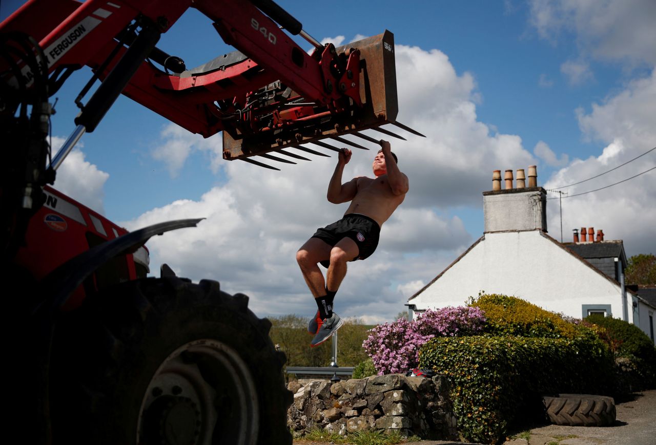 Professional rugby player Alex Craig trains at his parents' farm in Castle Douglas, Scotland, on May 4.