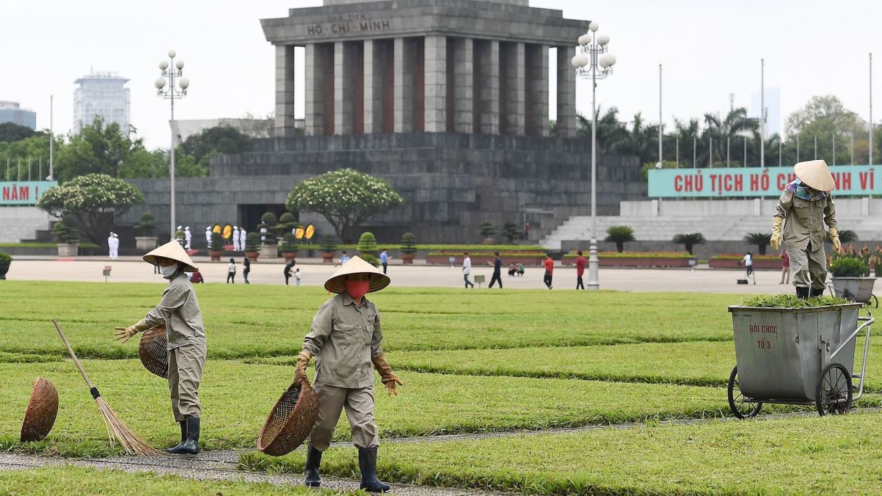 Municipal workers tend to the grass  outside the Ho Chi Minh mausoleum in Hanoi on May 13 as tourist spots began reopening.