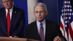 President Donald Trump watches as Dr. Anthony Fauci, director of the National Institute of Allergy and Infectious Diseases, approaches the podium to speak about the coronavirus in the James Brady Press Briefing Room of the White House in Washington DC, on Wednesday, April 22.