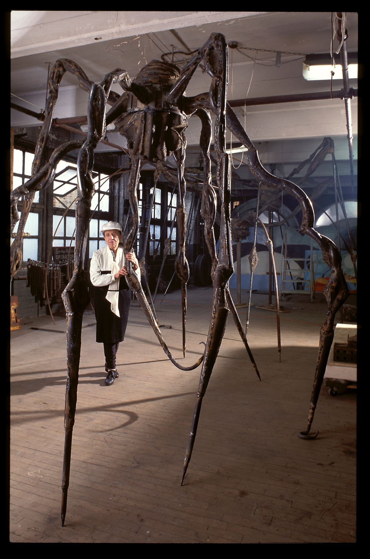 Louise Bourgeois in her Brooklyn studio with her sculpture "SPIDER" in 1995.