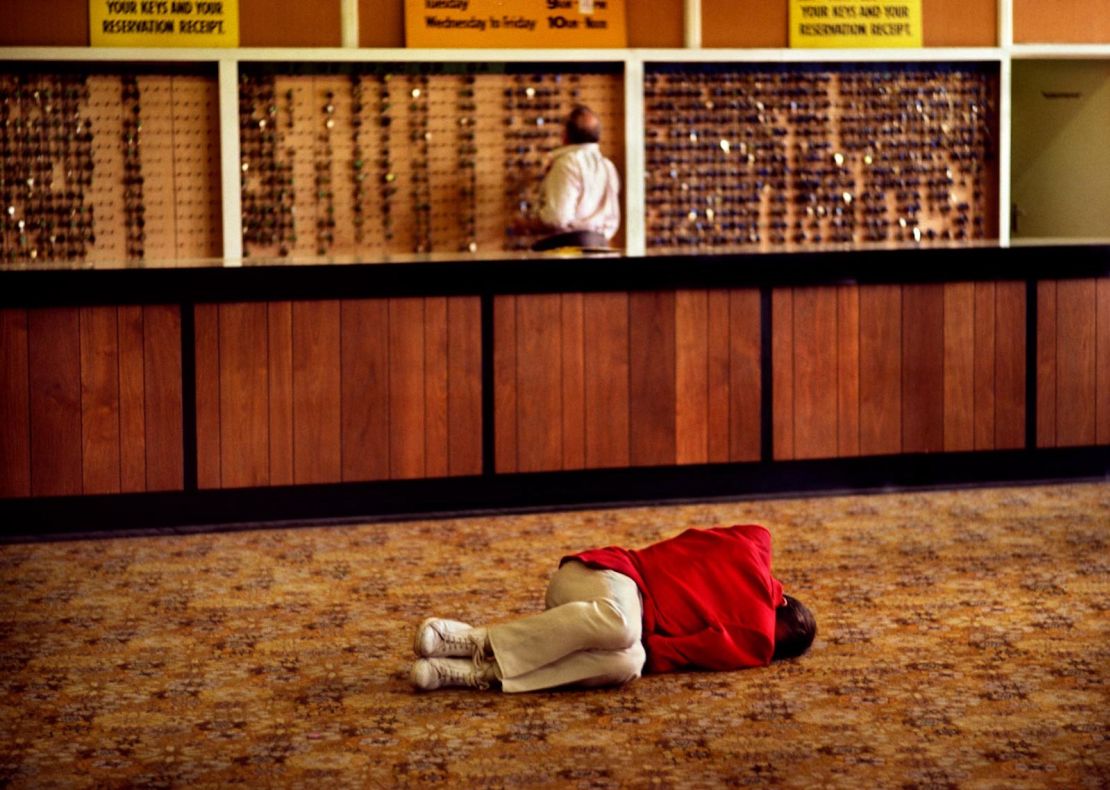 A Redcoat sleeps off a heavy night in the lobby.