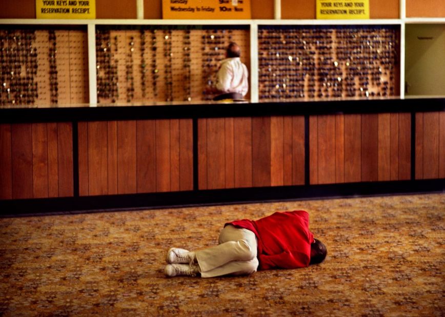 A employee sleeps off a heavy night in the lobby.