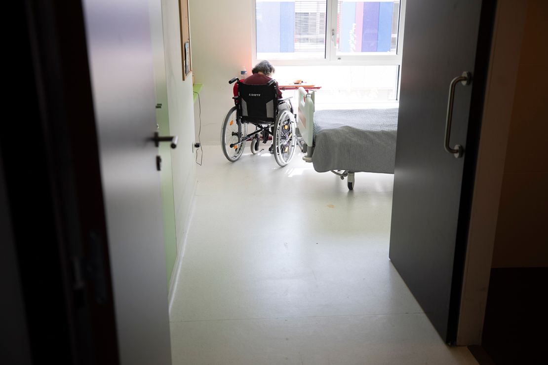 A resident sits in her room after being tested with Covid-19 in a nursing home in Bergheim, eastern France, on April 14.