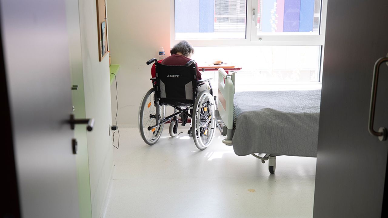 A resident sits in her room after being tested with Covid-19 in a nursing home in Bergheim, eastern France, on April 14.
