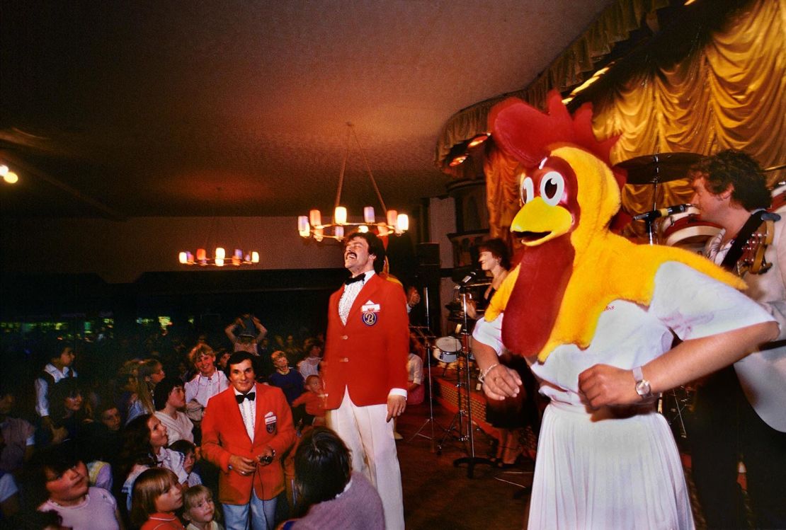 Employees perform a novelty dance they called the Rooster Rock.