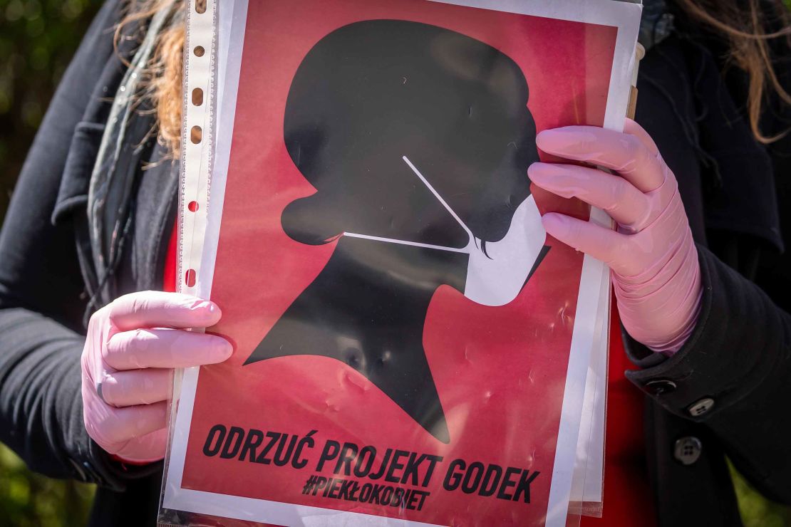 A women's rights activist protests in mid-April against a draft bill that would have drastically restricted abortions in Poland.