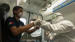 A paramedic from Escobedo, prepares to disinfect a house during a coronavirus drill, in Escobedo Nuevo Leon, Mexico, on March 15, 2020. - The protocol applied in a possible case of the virus, contemplates the person does not leave his address. After an emergency call of possible contagion, the health personal disinfect the outsider area and provides a cleaning kit until the arrival of medical specialist. (Photo by Julio Cesar AGUILAR / AFP) (Photo by JULIO CESAR AGUILAR/AFP via Getty Images)