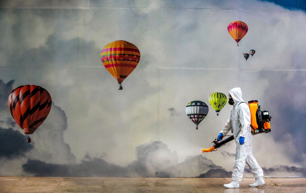 A worker disinfects a shopping mall in Caxias do Sul, Brazil, on Wednesday, May 13.