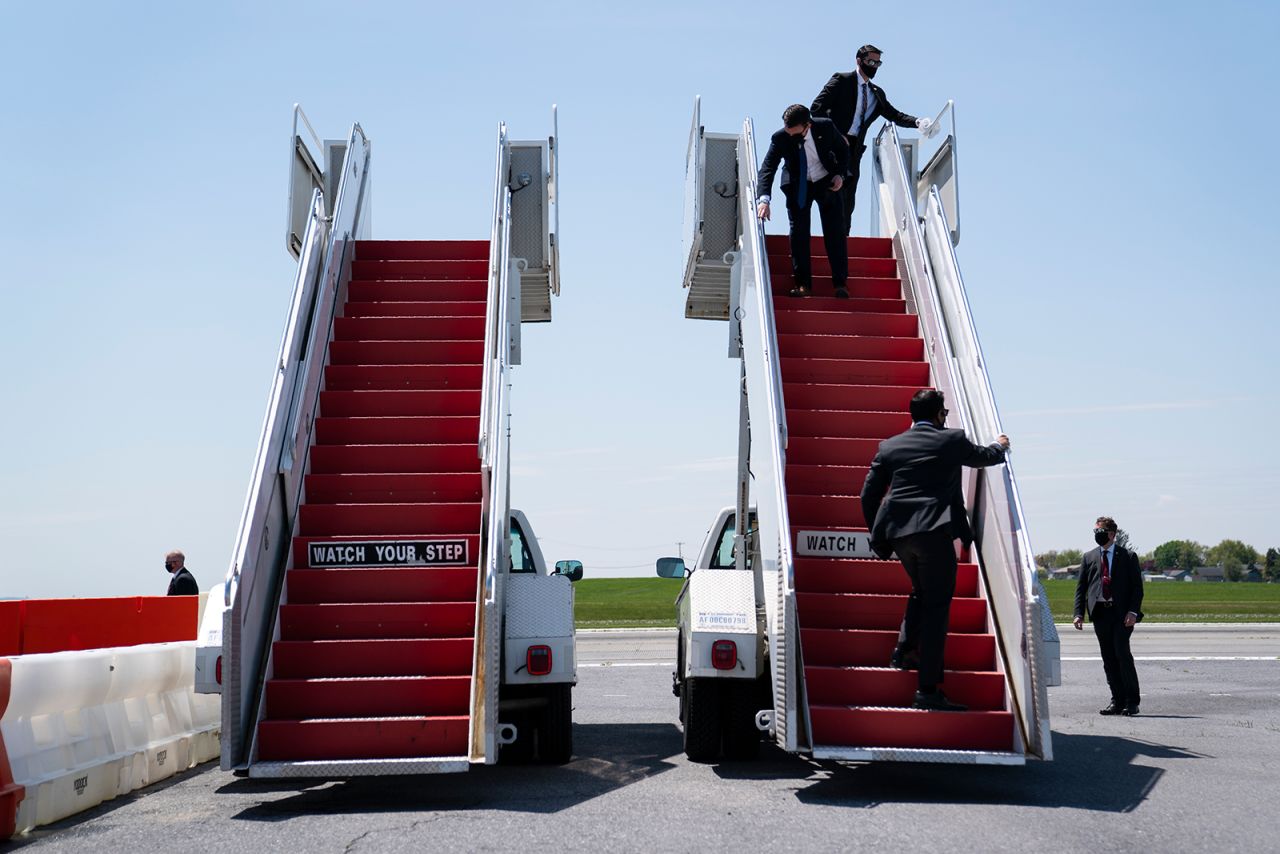 Members of the White House Military Office clean the stairs for Air Force One ahead of the President's arrival in Allentown, Pennsylvania, on Thursday, May 14.