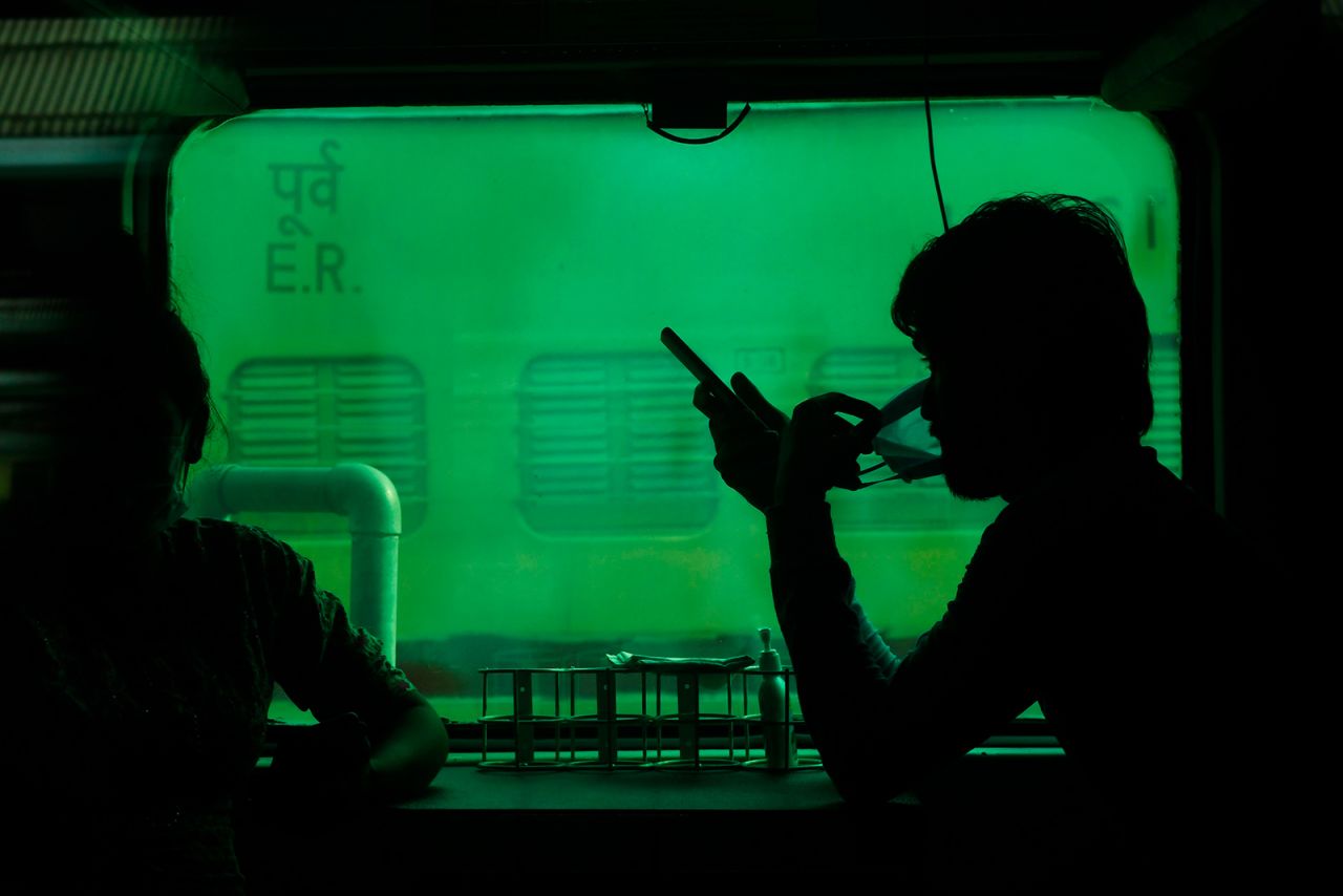 Passengers wait for a New Delhi-bound train to start in Kolkata, India, on Tuesday, May 12. The Indian government has begun to ease a nationwide lockdown.