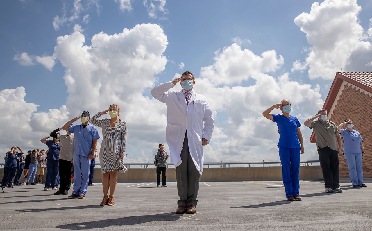 Doctors, nurses and other medical workers who served in the military salute the US Air Force "Thunderbirds" as the air demonstration squadron flies over St. David's Medical Center in Austin, Texas, on Wednesday, May 13. Flyovers have been taking place in cities across the country to show appreciation and support for essential workers. <a href="https://www.cnn.com/2020/05/07/world/gallery/week-in-photos-0507/index.html" target="_blank">See last week in 43 photos</a>