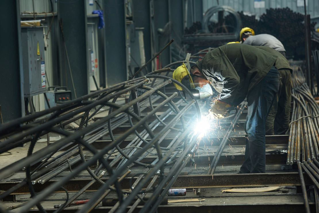 An employee works on steel bars at a factory in Hangzhou, in China's eaastern Zhejiang province on May 15, 2020.