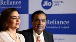 In this Aug. 12, 2019 file photo, Chairman of Reliance Industries Limited Mukesh Ambani, center, with wife Neeta Ambani arrives for 42nd Annual General Meeting of Reliance Industries Limited in Mumbai, India.