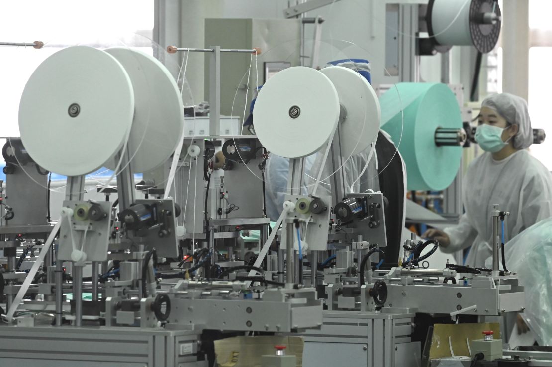 A staff of Taiwans Universal Incorporation, one of the major mask maker, operates machines at a factory in Tainan, southern Taiwan.