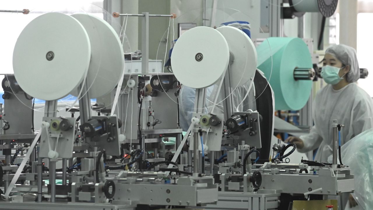 A staff of Taiwans Universal Incorporation, one of the major mask maker, operates machines at a factory in Tainan, southern Taiwan.