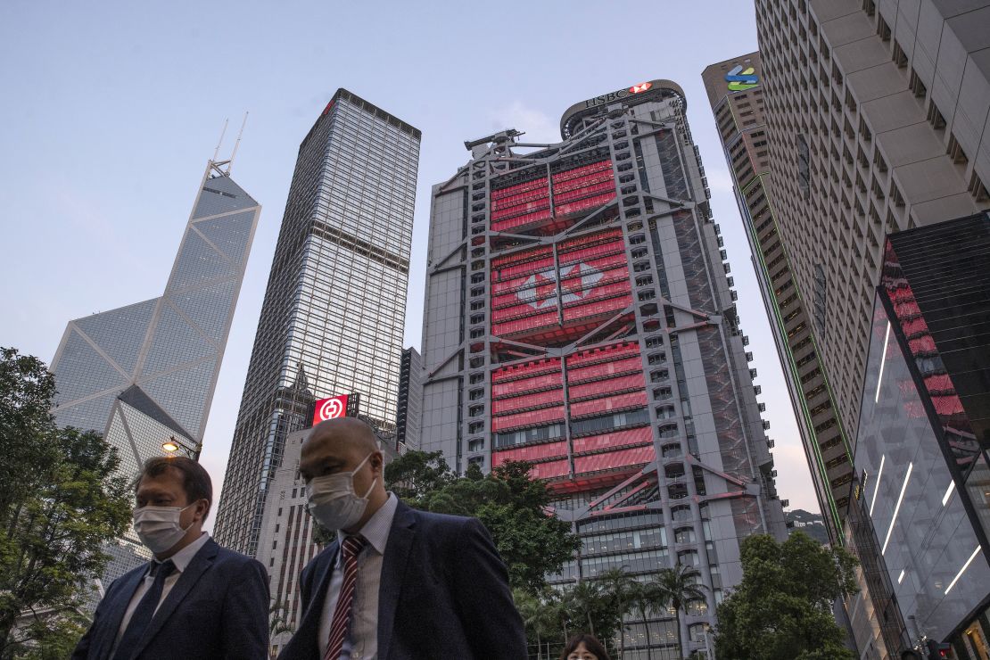 Pedestrians walking past HSBC's Hong Kong headquarters in April.