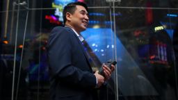 Zoom founder Eric Yuan poses in front of the Nasdaq building as the screen shows the logo of the video-conferencing software company Zoom after the opening bell ceremony on April 18, 2019 in New York City. The video-conferencing software company announced it's IPO priced at $36 per share, at an estimated value of $9.2 billion. (Photo by Kena Betancur/Getty Images)