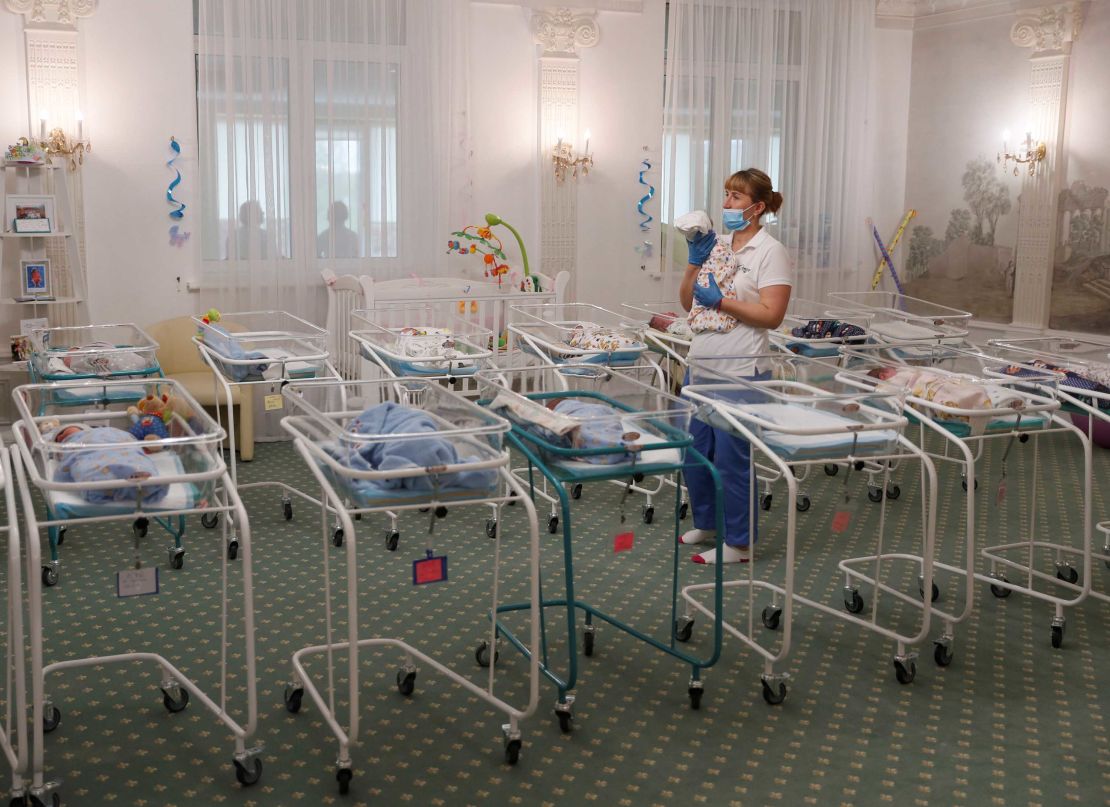 A nurse and newborns are seen in the Hotel Venice owned by BioTexCom clinic in Kiev.