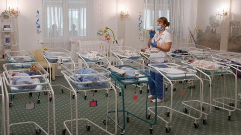 A nurse and newborns in the Hotel Venice in Kiev, Ukraine