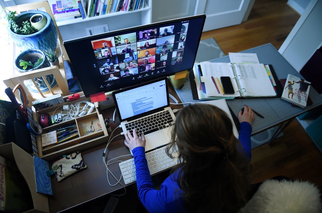 A substitute teacher works from her home in Arlington, Virginia, using Zoom to communicate with students and their families. (Olivier Douliery/AFP/Getty Images)