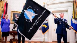 WASHINGTON, DC - MAY 15: Gen. Jay Raymond (R), Chief of Space Operations, and CMSgt Roger Towberman (L), with Secretary of the Air Force Barbara Barrett present US President Donald Trump with the official flag of the United States Space Force in the Oval Office of the White House in Washington, DC on May 15, 2020. (Photo by Samuel Corum-Pool/Getty Images)