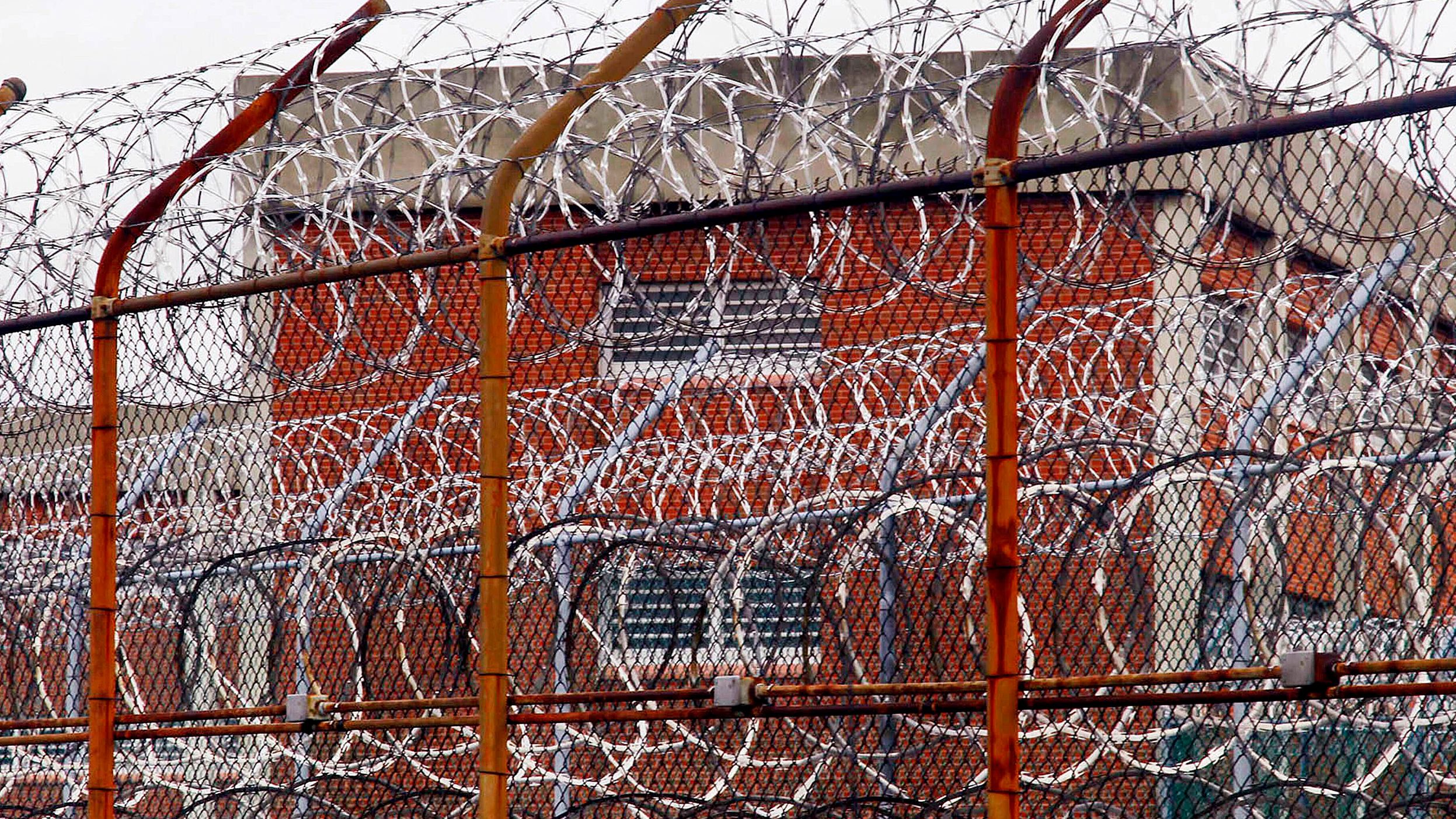 A security fence surrounds inmate housing on the Rikers Island correctional facility in New York in this 2011 photo.