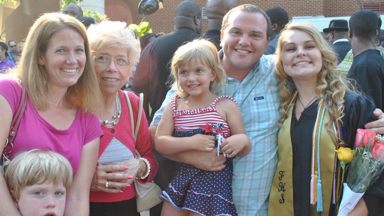 Principal Paul Pack, his wife Jessica and children Danny and Hailey with Susan Rokus at Katy Greiner's graduation.