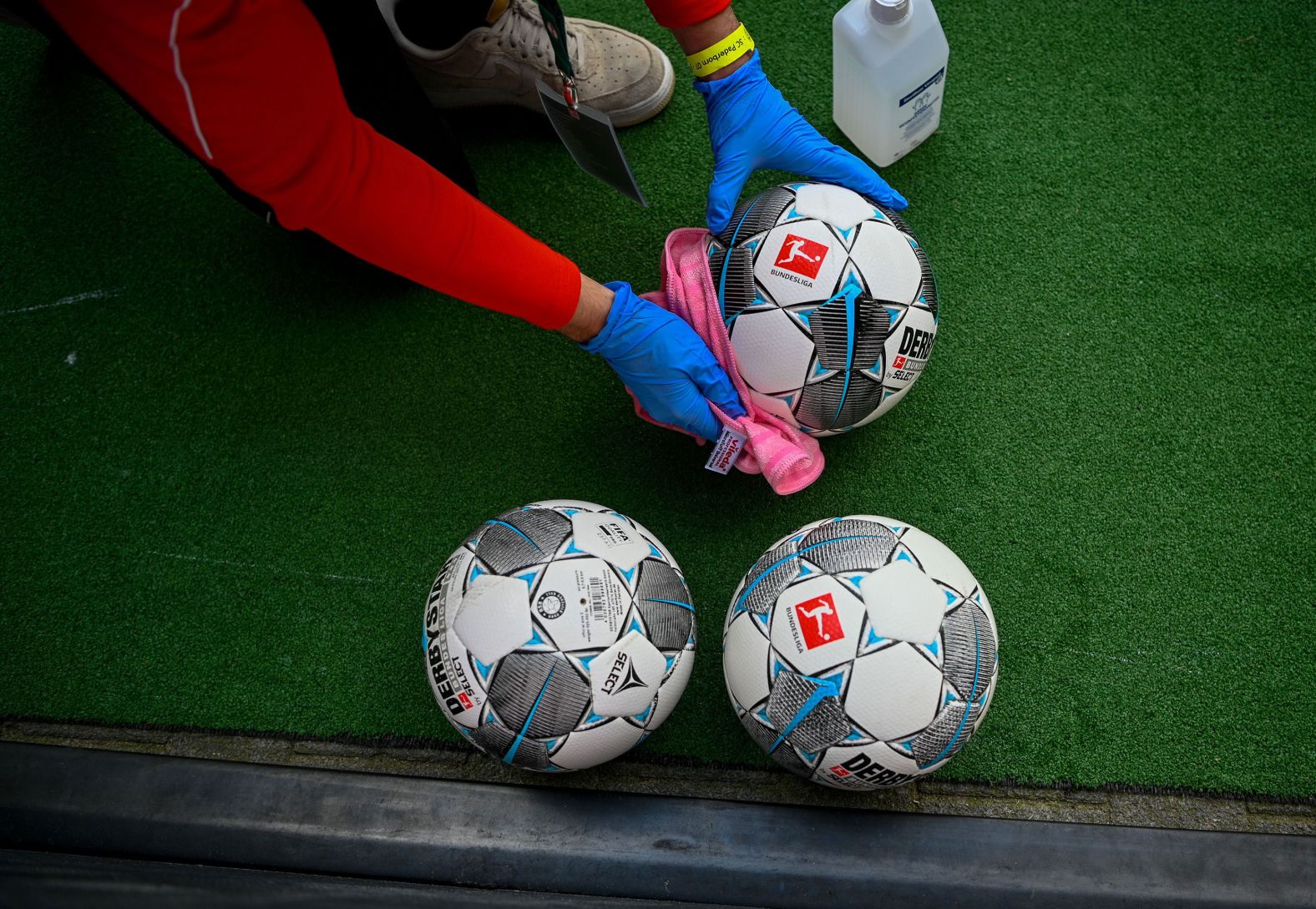 Soccer balls are disinfected at a professional match in Düsseldorf, Germany, on May 16. Germany's Bundesliga was <a  target="_blank">the first major European soccer division to return to action.</a>