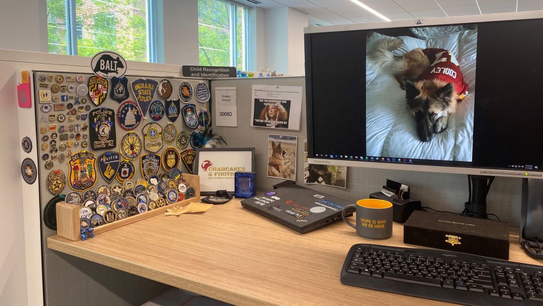 Shelley Allwang, her desk seen here, works on a team of roughly 80 people at the National Center for Missing & Exploited Children who have all had their attention set on its CyberTipline recently.