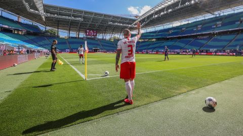 Angelino, a professional soccer player with the German club RB Leipzig, takes a corner kick during a Bundesliga match against Freiburg on May 16, 2020. The stadium was nearly empty, as <a href="https://www.cnn.com/2020/05/15/football/bundesliga-return-soccer-safety-spt-intl/index.html" target="_blank">no more than 322 people</a> were able to attend each Bundesliga match until the end of the season. 