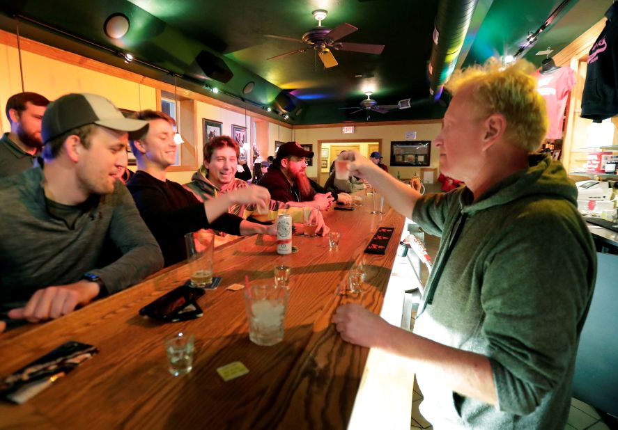Owner Michael Mattson toasts the re-opening of the Friends and Neighbors bar in Appleton, Wisconsin, following the Wisconsin Supreme Court's decision <a href="https://www.cnn.com/2020/05/13/politics/wisconsin-supreme-court-strikes-down-stay-at-home-order/index.html" target="_blank">to strike down the state's stay-at-home order</a> on May 13.