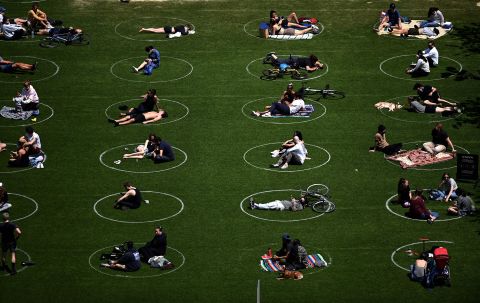 People practice social distancing in New York's Domino Park on May 17, 2020.