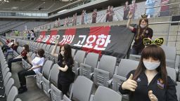 In this May 17, 2020, photo, cheering mannequins are installed at the empty spectators' seats before the start of a soccer match between FC Seoul and Gwangju FC at the Seoul World Cup Stadium in Seoul, South Korea. A South Korean professional soccer club has apologized after being accused of putting sex dolls in empty stands during a match Sunday in Seoul. In a statement, FC Seoul expressed "sincere remorse" over the controversy, but insisted that it used mannequins, not sex dolls, to mimic a home crowd during its 1-0 win over Gwangju FC at the Seoul World Cup stadium. (Ryu Young-suk/Yonhap via AP)