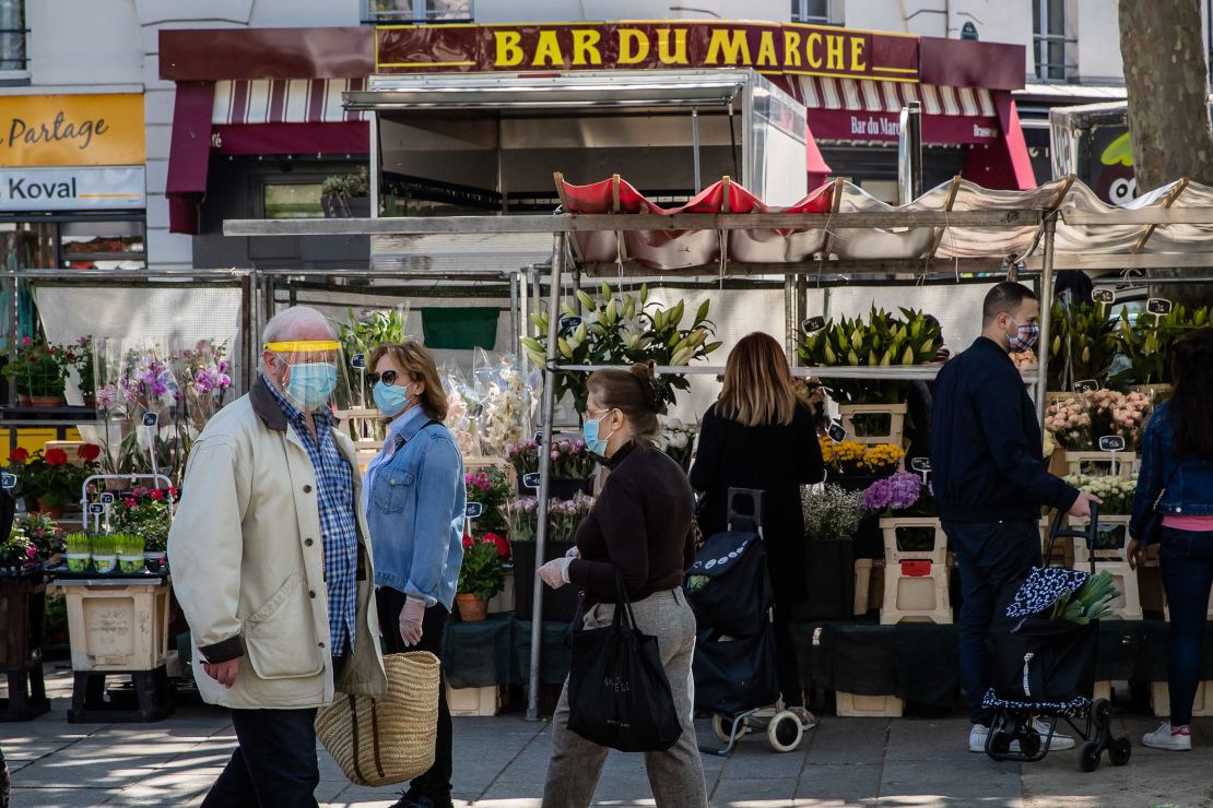 Shoppers at the Place de la Bastille market in Paris, on May 17, 2020.