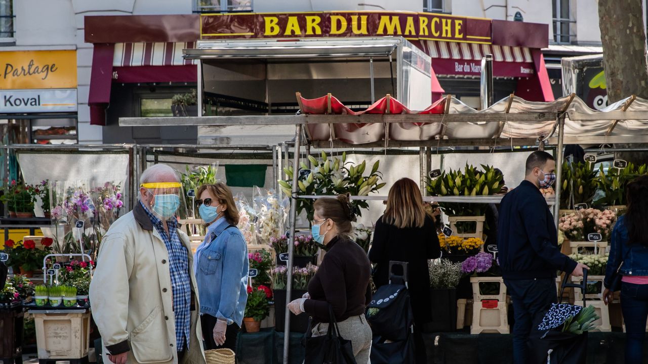 Shoppers at the Place de la Bastille market in Paris, on May 17, 2020. 