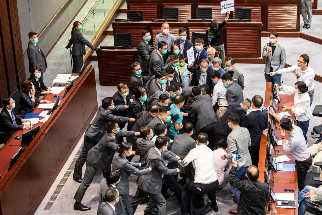 Pro-democracy and pro-Beijing lawmakers scuffle at the House Committee's election of chairpersons on May 18.