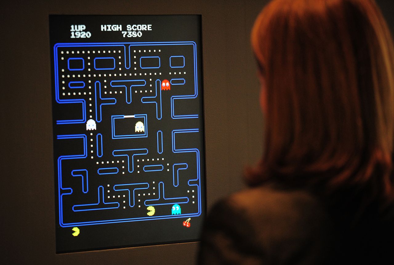 Paola Antonelli, senior curator of architecture and design at the Museum of Modern Art (MoMA)  plays "Pac-Man" at an exhibition preview in 2013. 