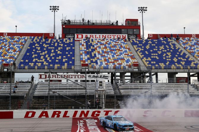Kevin Harvick celebrates with a burnout after winning a NASCAR Cup Series race in Darlington, South Carolina, on May 17, 2020. It was <a href="index.php?page=&url=https%3A%2F%2Fwww.cnn.com%2Fworld%2Flive-news%2Fcoronavirus-pandemic-05-17-20-intl%2Fh_e8560781fc2629b4a53f4aa0f0623dee" target="_blank">NASCAR's first race</a> since its season was halted because of the pandemic. No fans were in attendance.