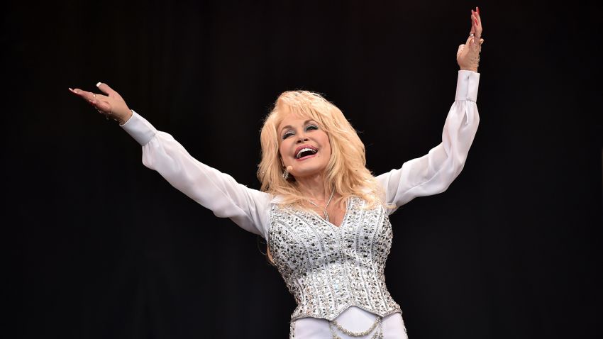 US country music singer Dolly Parton performs on the Pyramid Stage, on the final day of the Glastonbury Festival of Music and Performing Arts on Worthy Farm in Somerset, southwest England, on June 29, 2014.  AFP PHOTO / LEON NEAL        (Photo credit should read LEON NEAL/AFP via Getty Images)