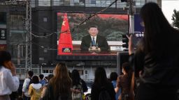 A news program shows Chinese President Xi Jinping speaking via video link to the World Health Assembly, on a giant screen beside a street in Beijing on May 18, 2020. - China supports a "comprehensive evaluation" of the global response to the coronavirus pandemic after it "has been brought under control", President Xi Jinping told the World Health Assembly on May 18. (Photo by GREG BAKER / AFP) (Photo by GREG BAKER/AFP via Getty Images)