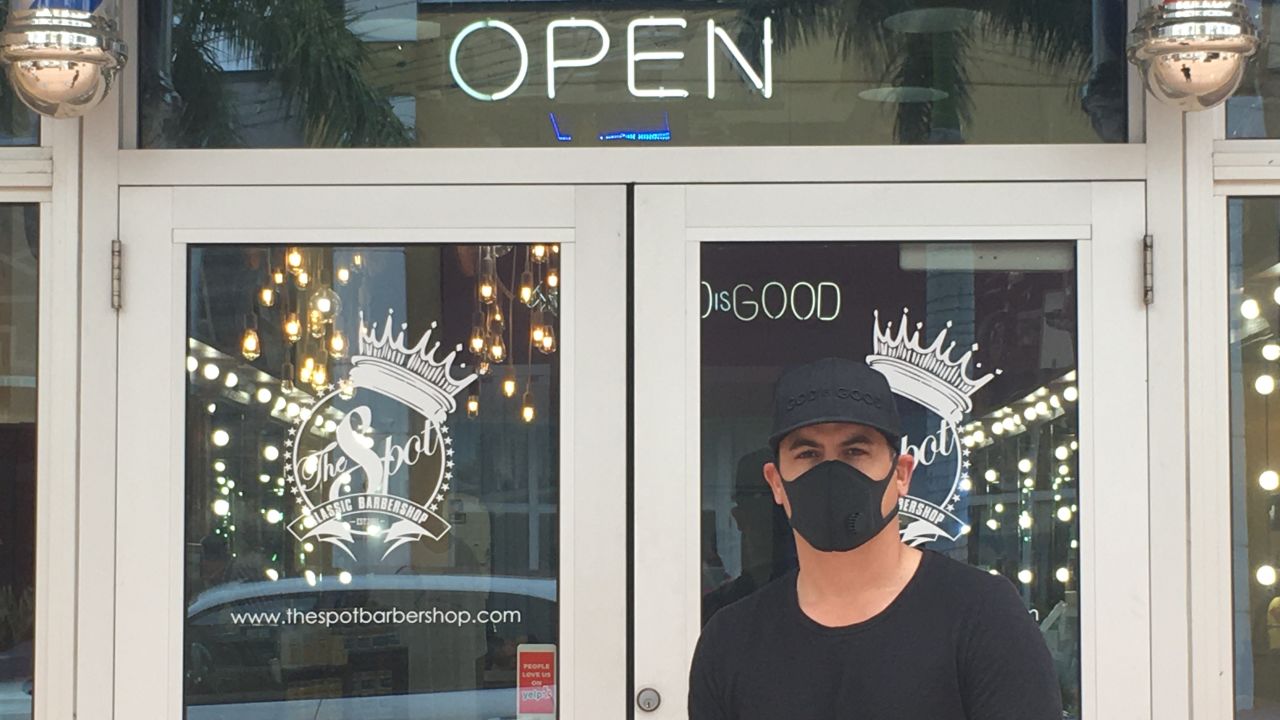 Mike Risco, CEO of The Spot Barber Shop in Doral, Florida, reopened his shop Monday.
