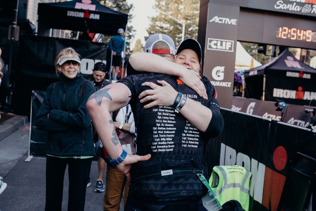 Shauna Springer with her friend Mike Ergo,  a Licensed Clinical Social Worker, who is a former combat Marine and sponsored Ironman triathlete. He runs in honor of soldiers lost to suicide and combat. He lists their names on his race jerseys. 