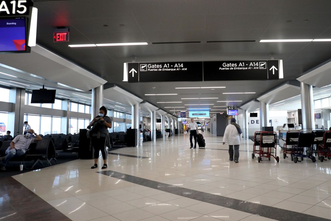 Passengers wait to board a flight at Hartsfield-Jackson Atlanta International Airport on April 20, 2020.