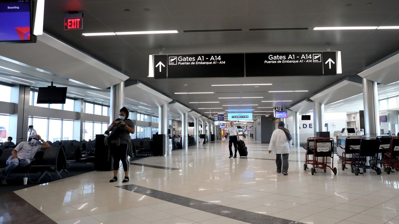 Passengers wait to board a flight at Hartsfield-Jackson Atlanta International Airport on April 20, 2020.