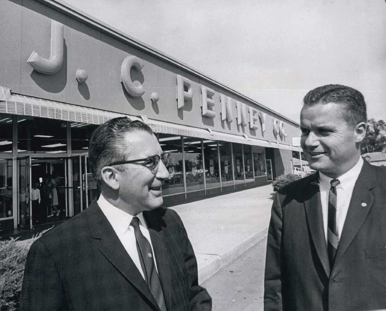 A couple of store managers, George F. McDougall and Graham Vaughn, confer at a Denver location in 1963.