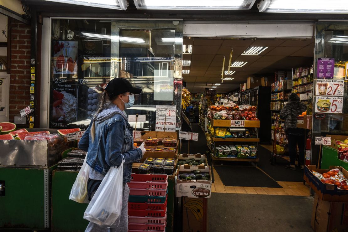 A person wearing a protective mask shops for groceries on May 13 in Brooklyn, New York.