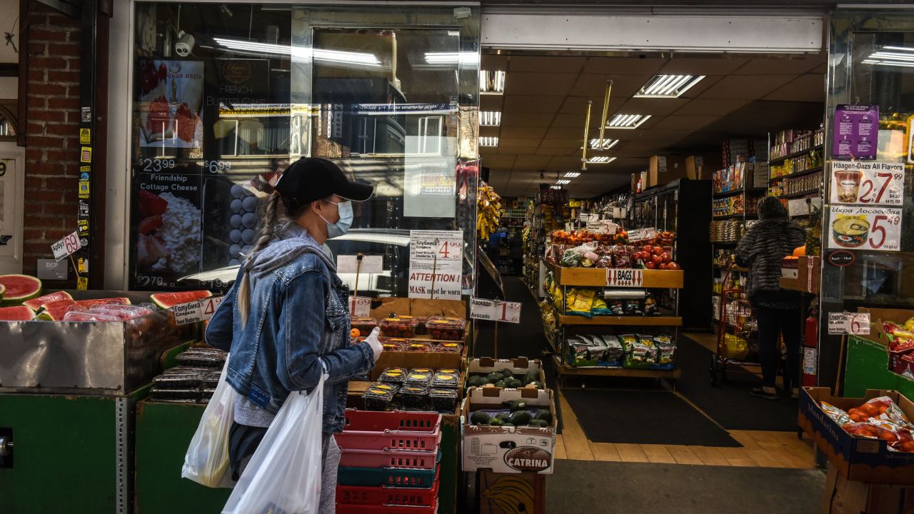 A person wearing a protective mask shops for groceries on May 13 in Brooklyn, New York.