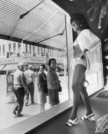 A woman does a double take after seeing what she thought was a mannequin move in a JCPenney window in 1972.