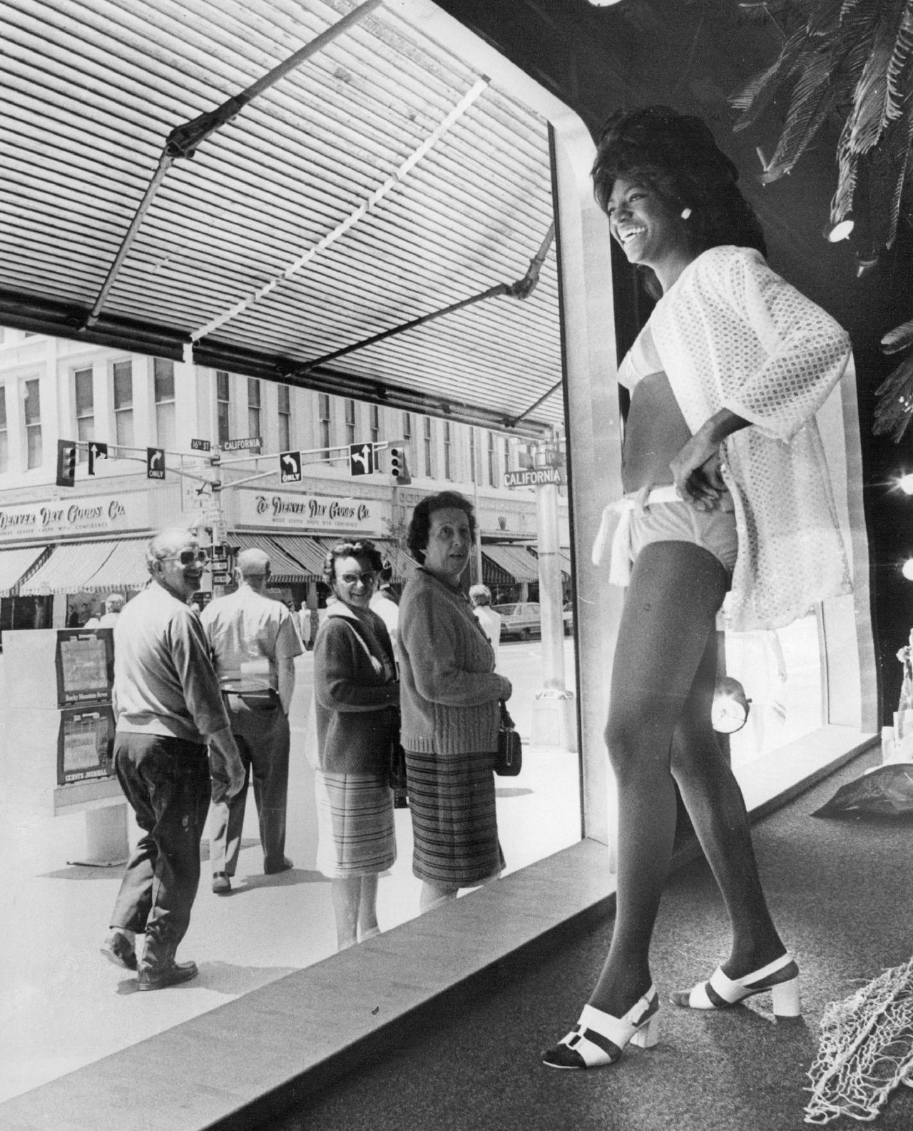 A woman does a double take after seeing what she thought was a mannequin move in a JCPenney window in 1972.